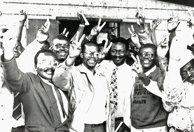 FORD KENYA OFFICIALS MUKHISA KITUYI, MUSIKARI KOMBO AND OTHER SUPPORTERS OUTSIDE KISII COURT MAY 1994